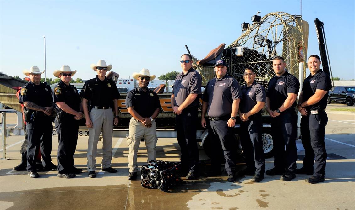 Representing the Fort Bend County Sheriff’s office and Northeast Fire Department Regional Dive Team are, left to right, Patrol Lt. Josh Dale, Patrol Major James Burger, Asst. Chief Manuel Zamora, Sheriff Eric Fagan, Fire Chief Travis Baxter, Asst. Fire Chief Robert Gomez, Capt. Donney Guebara, and firefighters Christian Bruner and Robert Valdez.